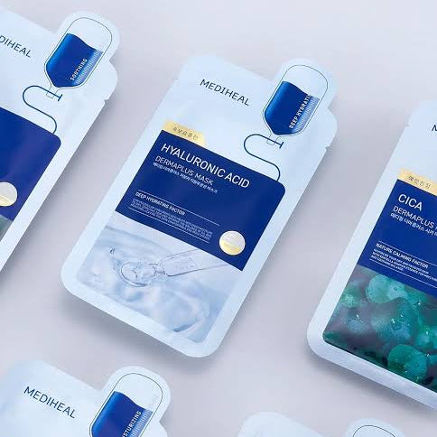 Mediheal skincare sheet mask pouches arranged diagonally on a light pink background, featuring Hyaluronic Acid and Cica Centrus Plus variants.