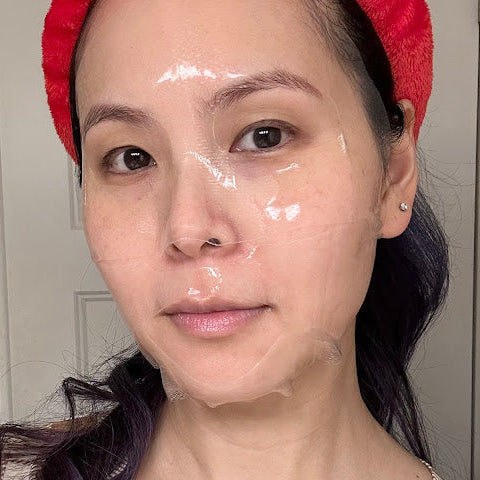 Person wearing MEDIHEAL NMF Nude Gel Mask Sheet from The Pharmacy Lab for a hydrating skincare routine.