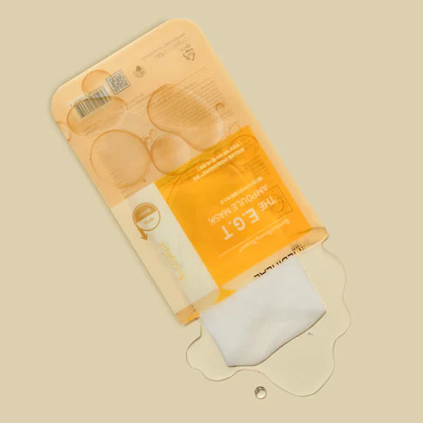 MEDIHEAL The E.G.T Nourishing Ampoule Mask packaging opened with the sheet mask partially pulled out and ampoule essence visible.