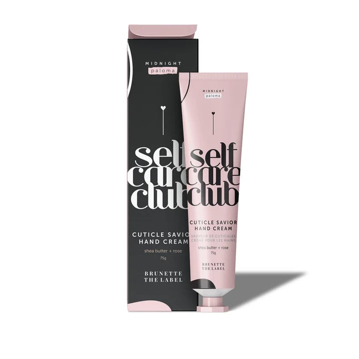 Pink tube of cuticle savior hand cream with black packaging on a white background