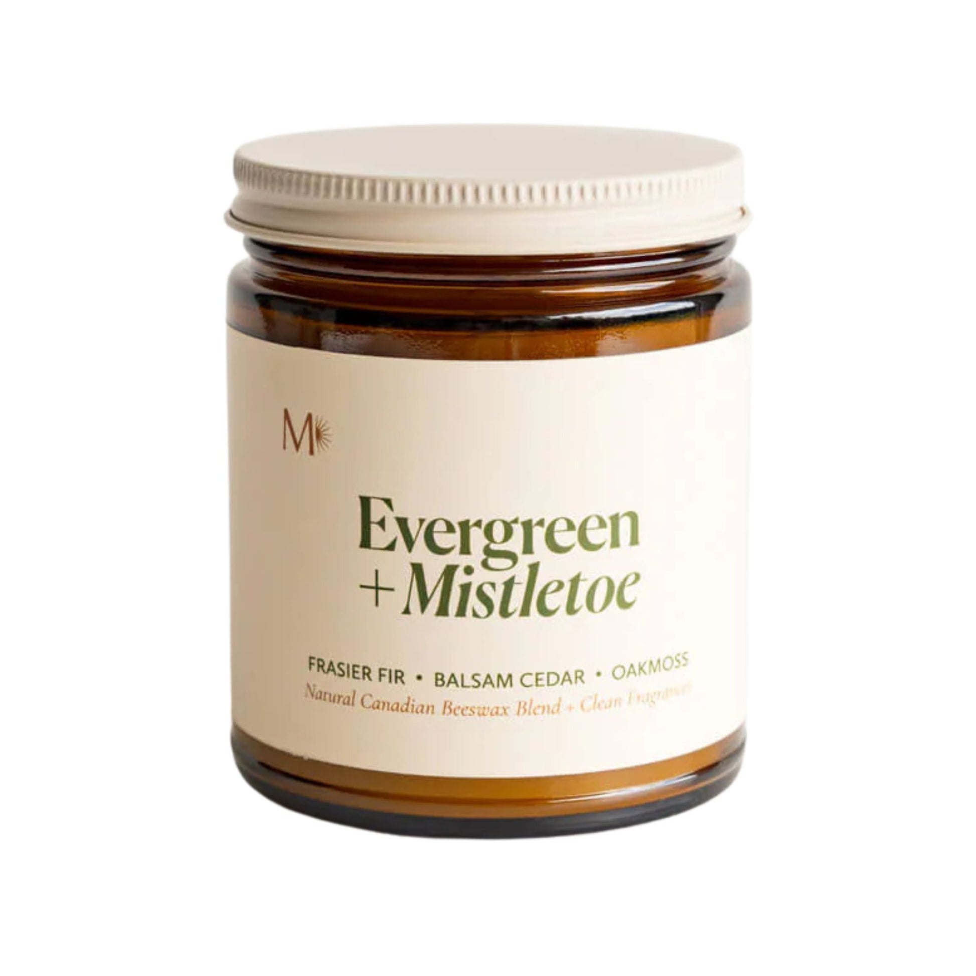 Candle jar labeled 'Evergreen + Mistletoe' on a white background