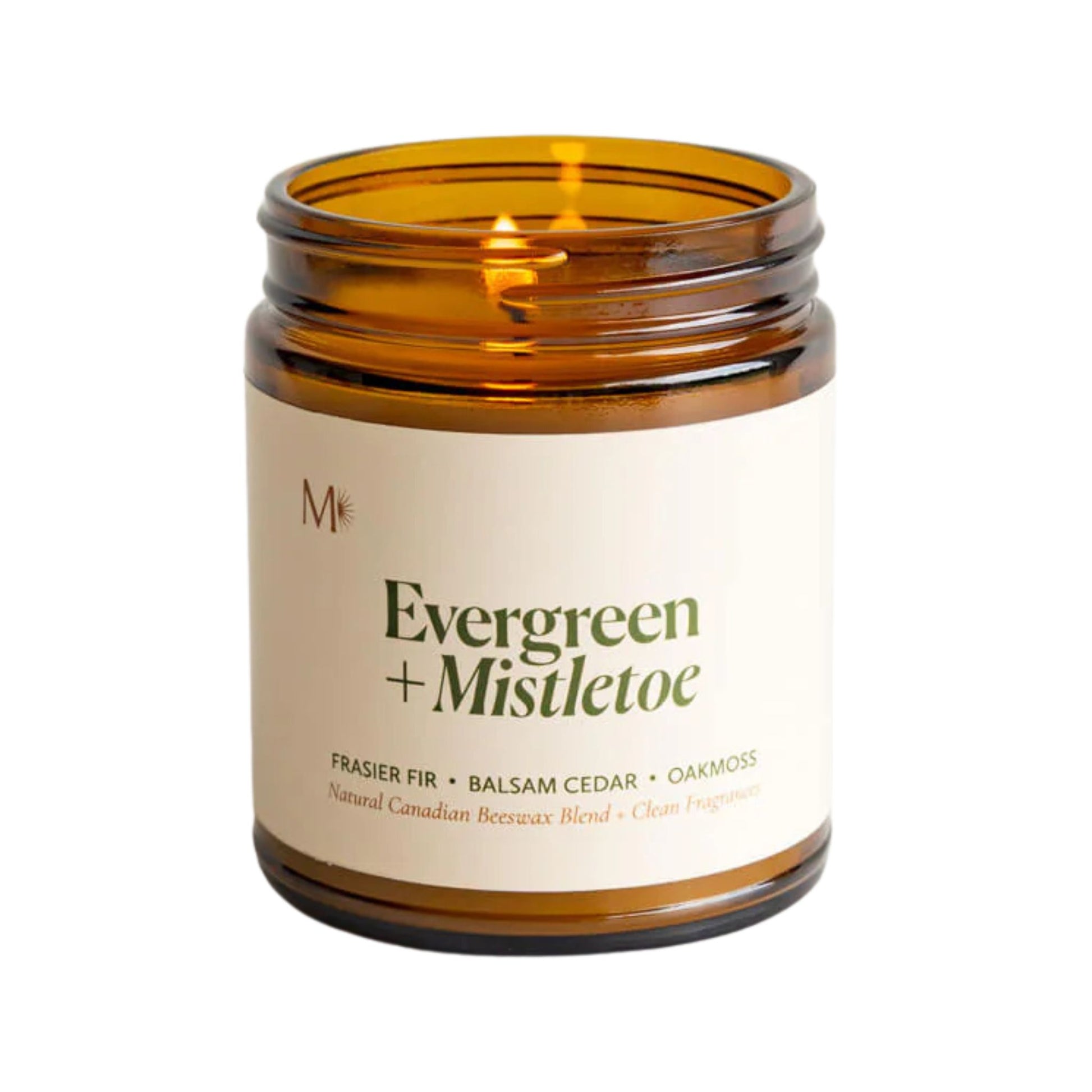 Candle in an amber jar with a white label on a white background