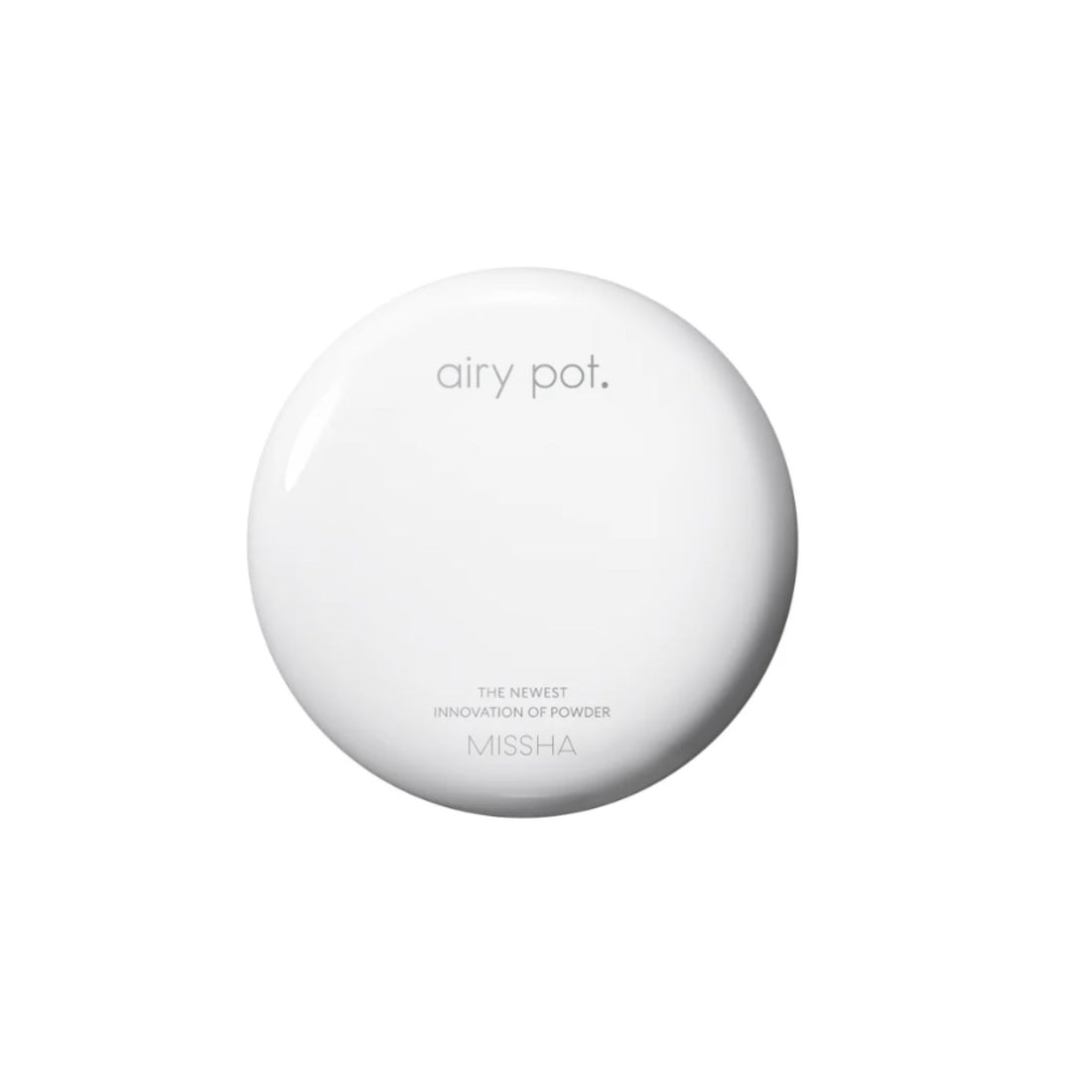 Round white device with buttons on a white background
