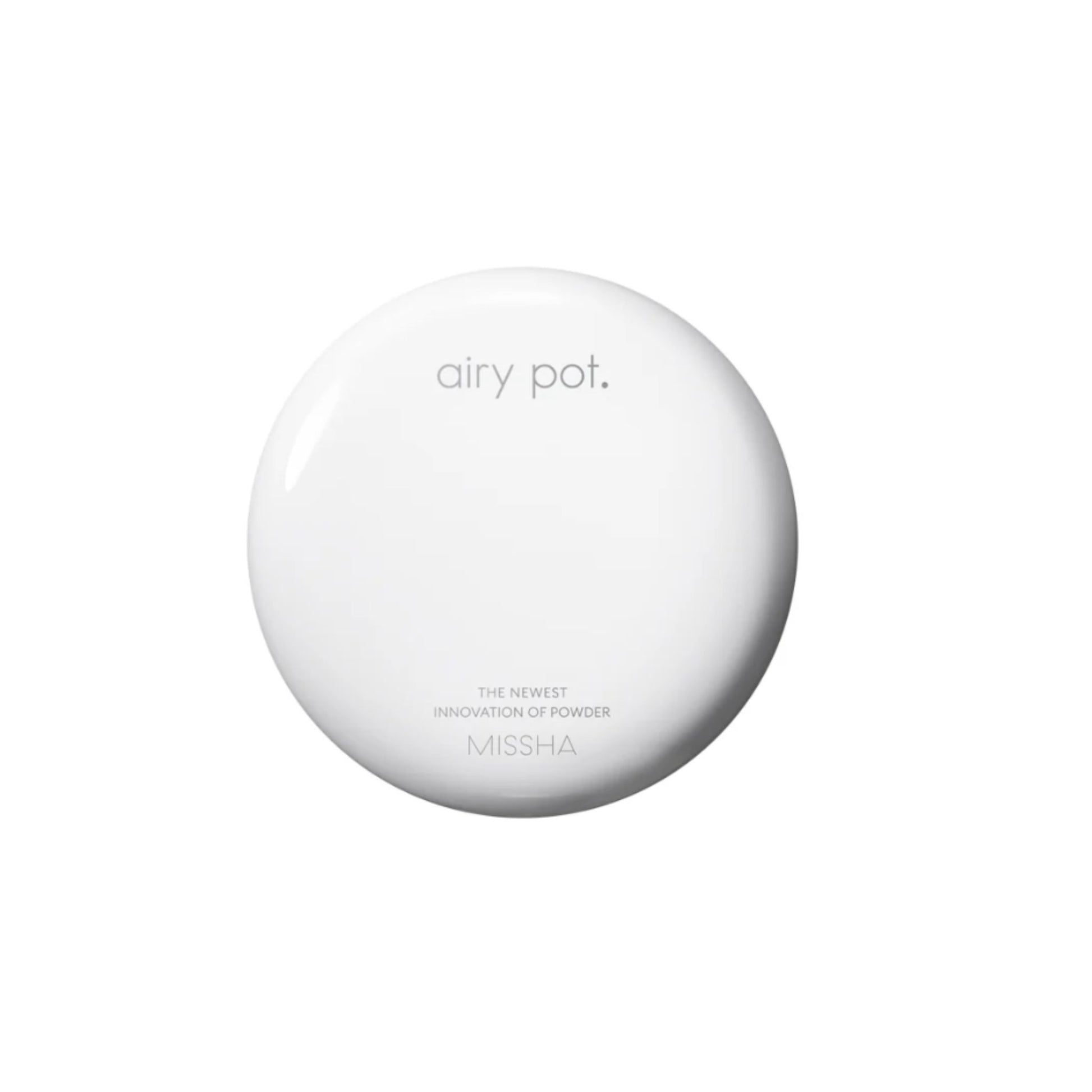 Round white device with buttons on a white background
