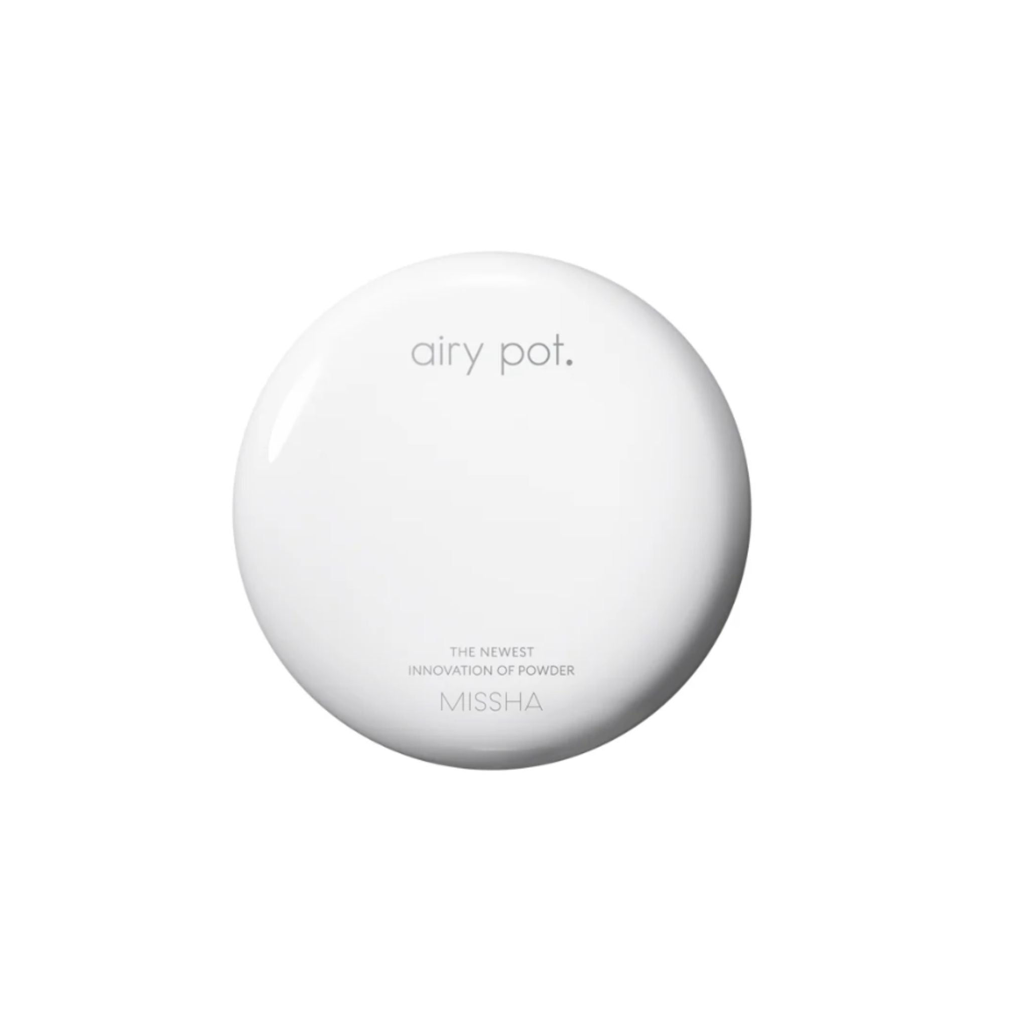 Round white device with buttons on a white background