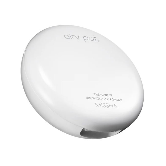 White powder compact with 'Missha' branding on a white background