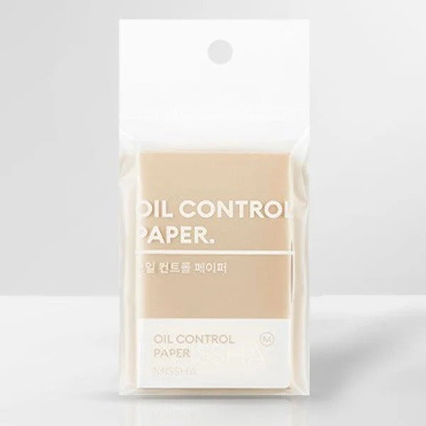 Pack of oil control paper with beige color on a white background