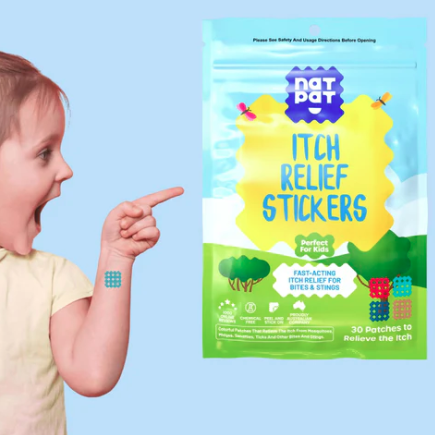 Child with a lollipop pointing to a package of Itch Relief Stickers on a blue background