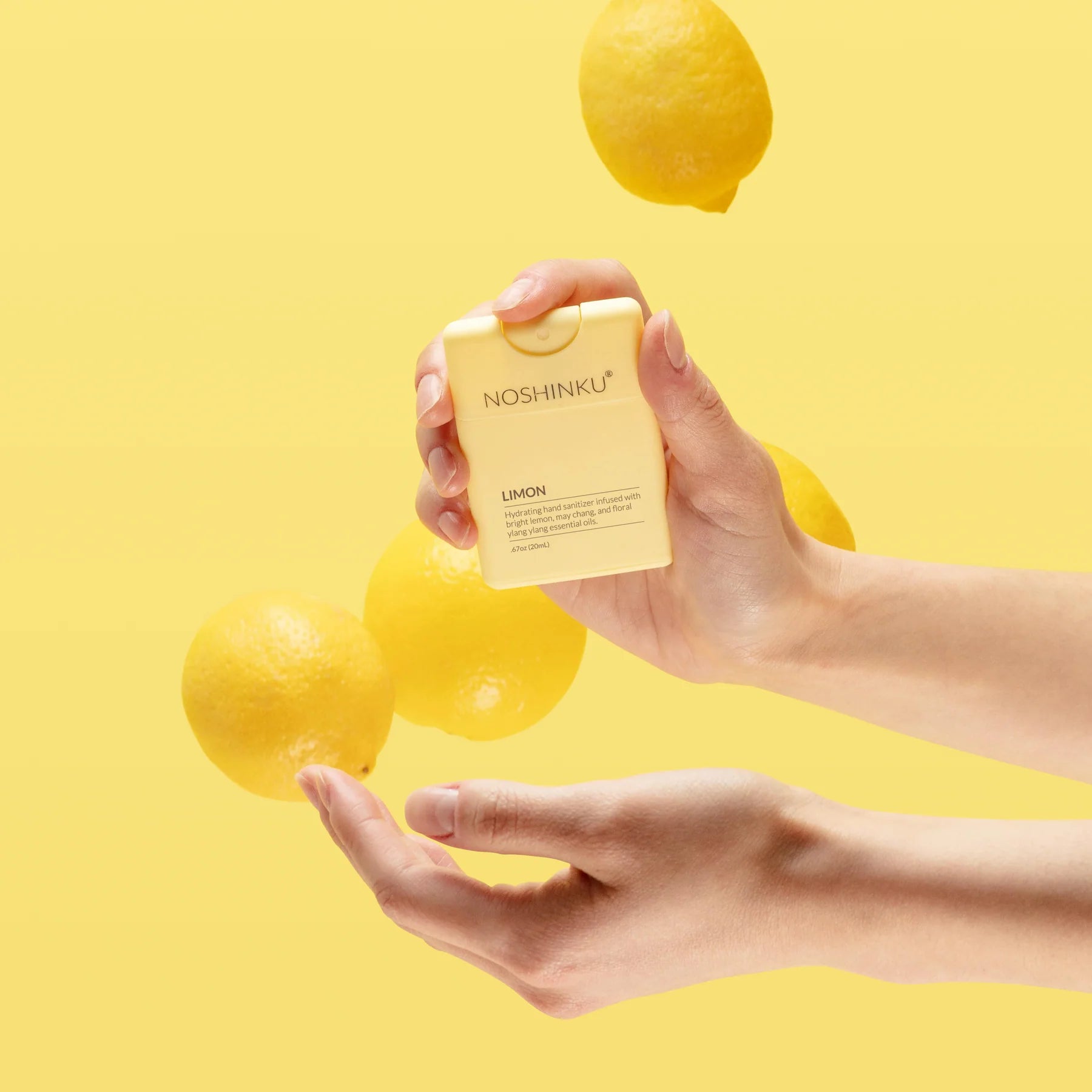 Lifestyle image of The Pharmacy Lab Noshinku Limon Pocket Sprayer portable citrus hand sanitizer with fresh lemons