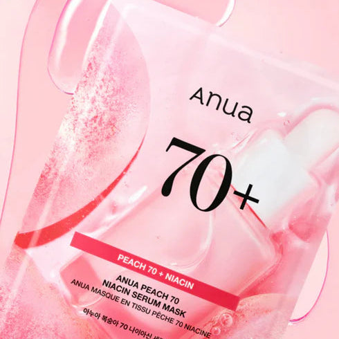 Anua Peach 70+ Niacin serum mask packaging on a pink background