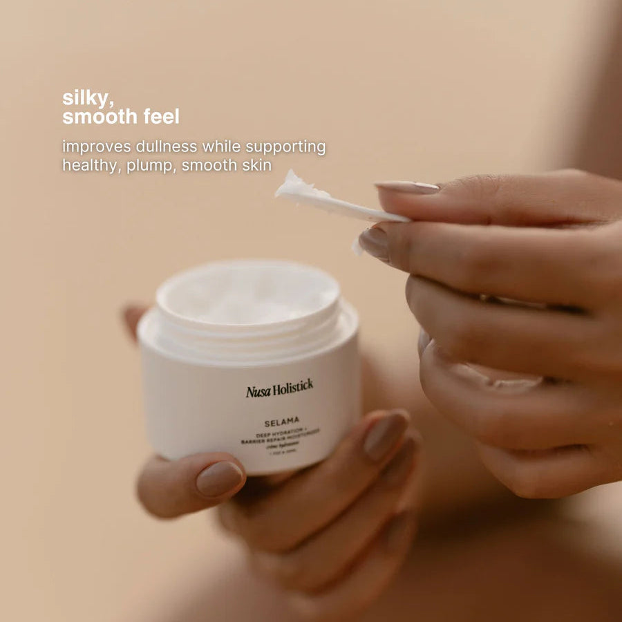 Person holding a jar of Azar Holistic skincare product with a neutral background