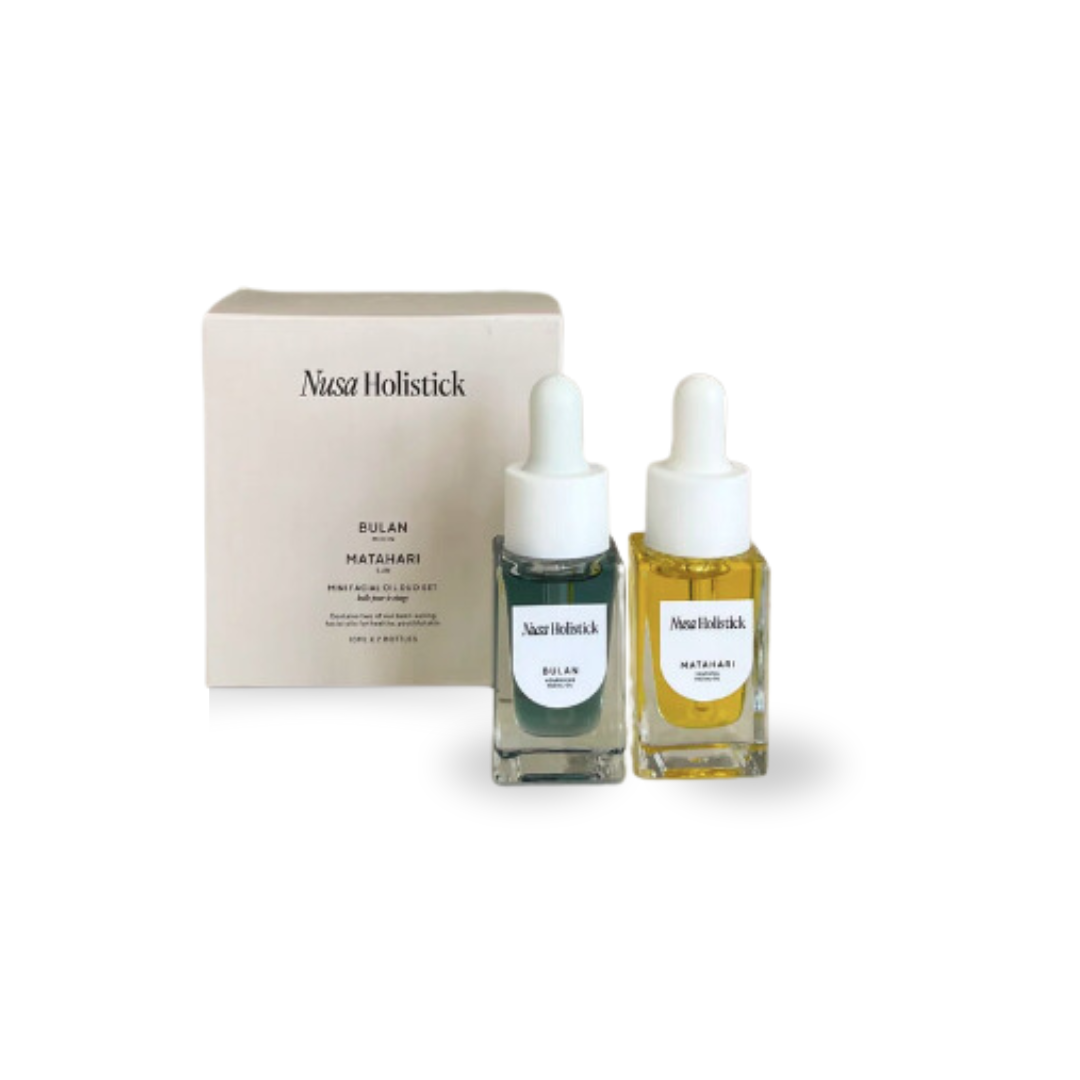 Two skincare serum bottles with a box labeled 'Nuxe Holistic' on a white background