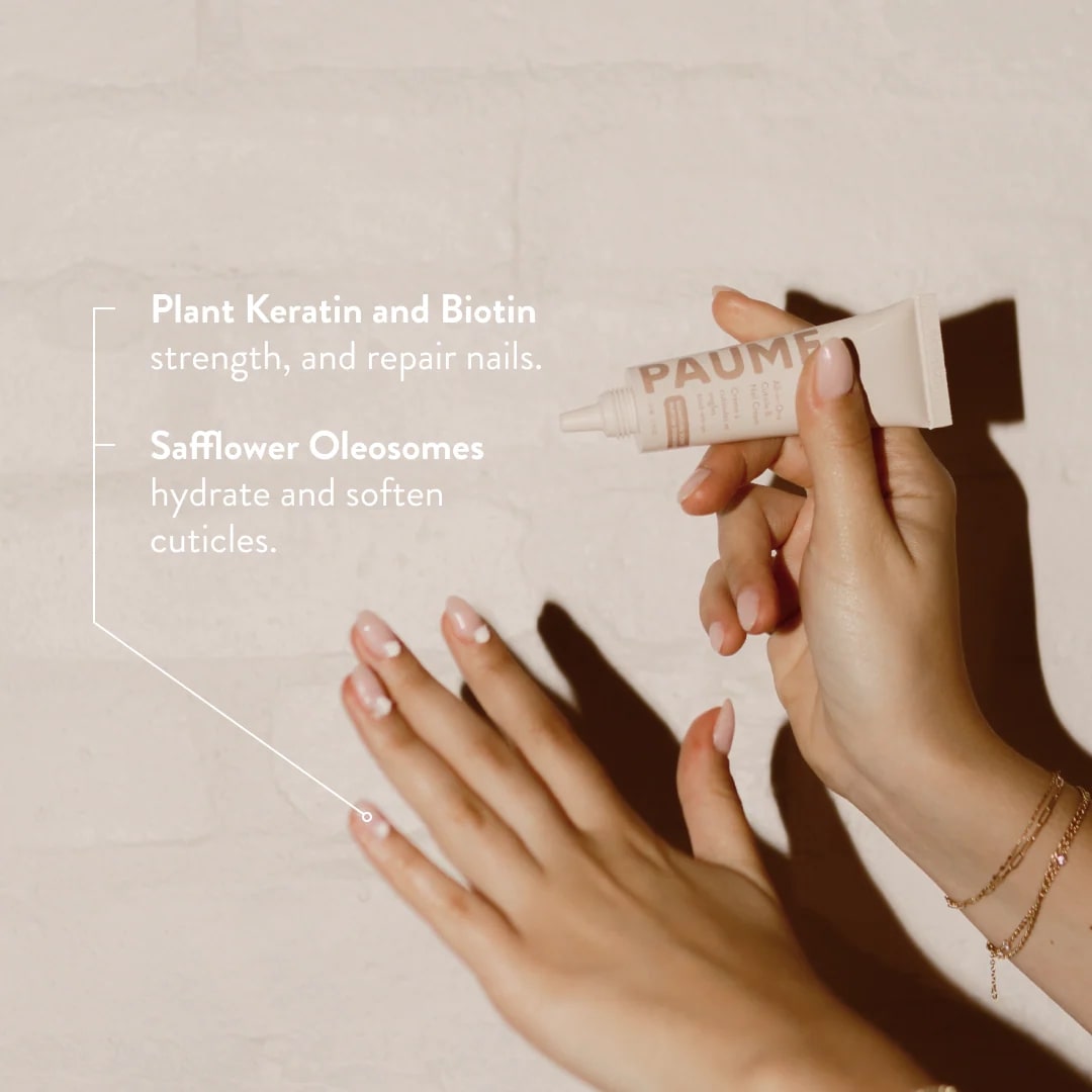 Hand applying a nail care product with text about plant keratin, biotin, safflower oleosomes, and cuticle care.