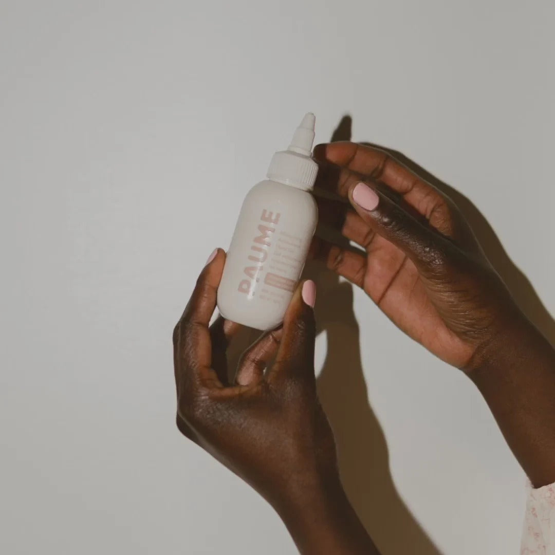 PAUME hand gel bottle on a white background