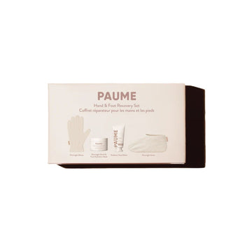PAUME Hand & Foot Recovery Set in its original packaging, featuring a cream-colored box with illustrations of the included items: a hand glove, a jar of foot bath salts, a tube of foot cream, and a face mask.