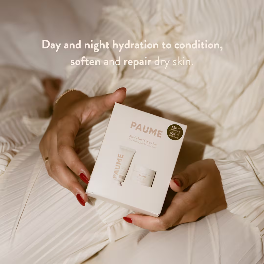 Person holding a PAUME skincare product box with text about skin hydration.
