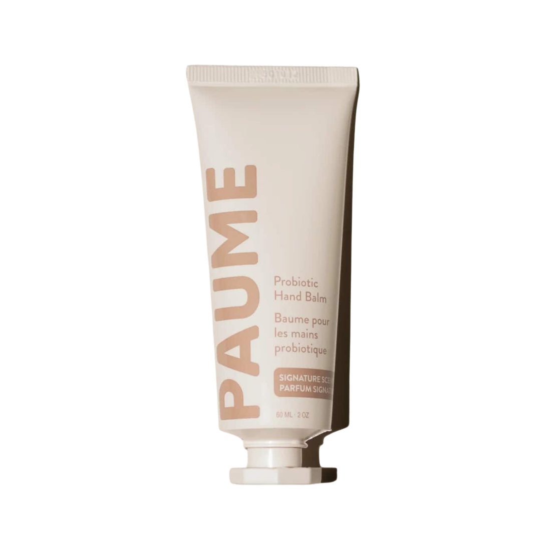 Tube of Paume hand balm on a white background