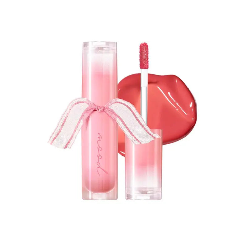Lip gloss set with applicator on a white background