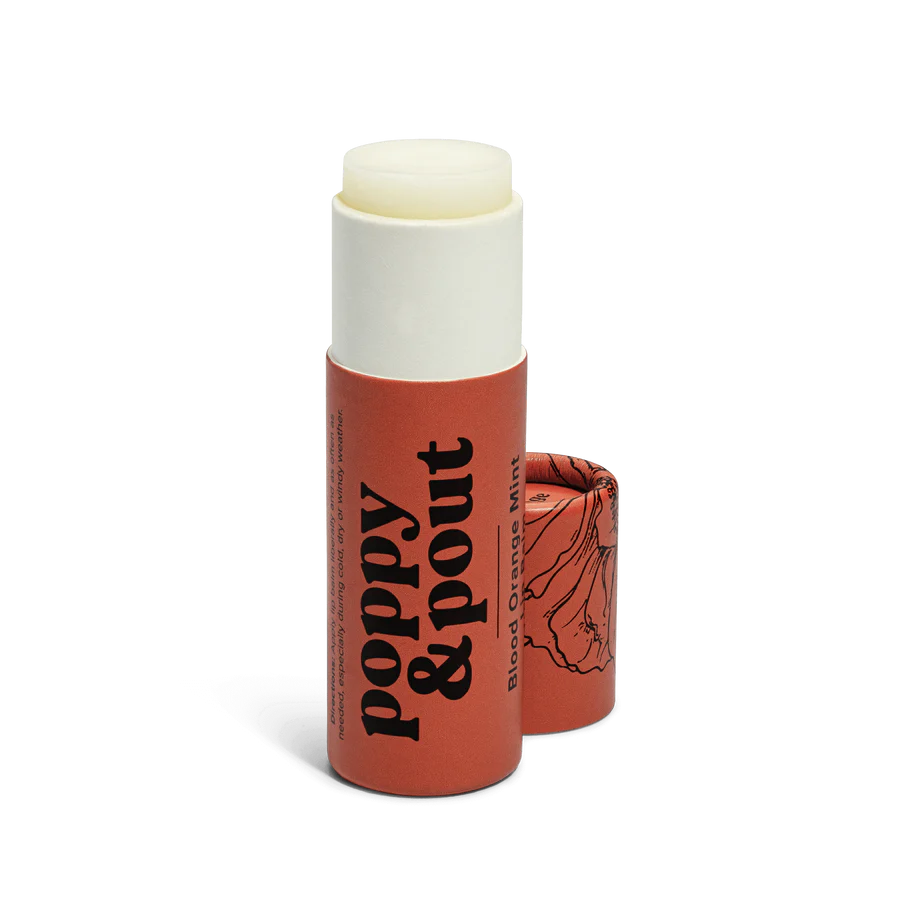 Lip balm with 'Poppy & Pout' branding on a white background