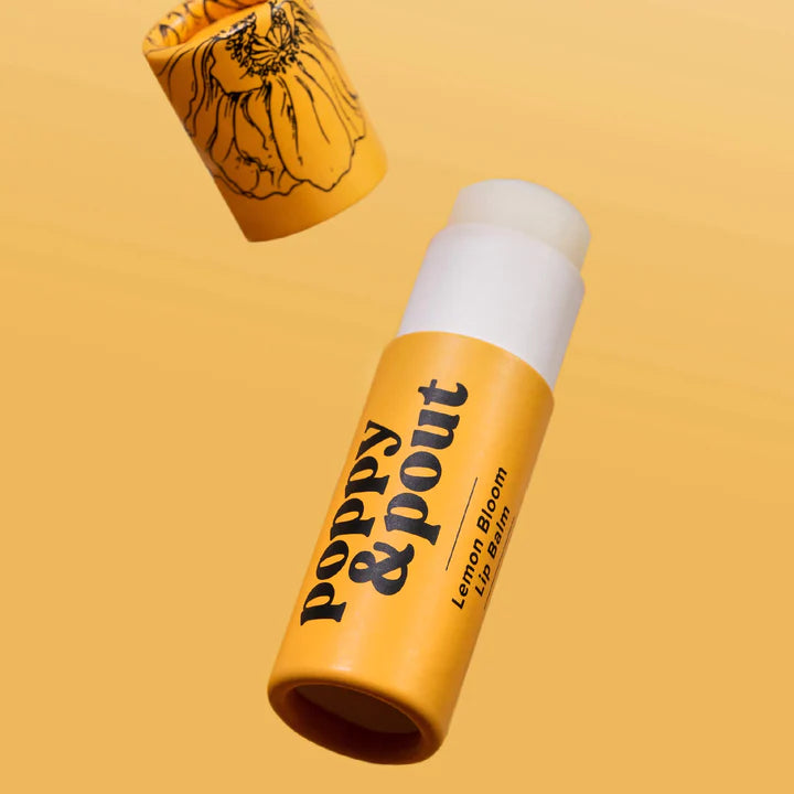 Yellow lip balm with 'Poppy & Pout' branding on a yellow background