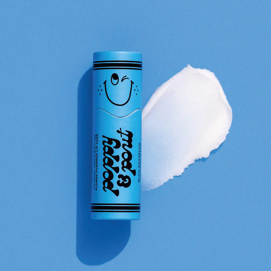 Blue tube with a smiley face and white cream on a blue background