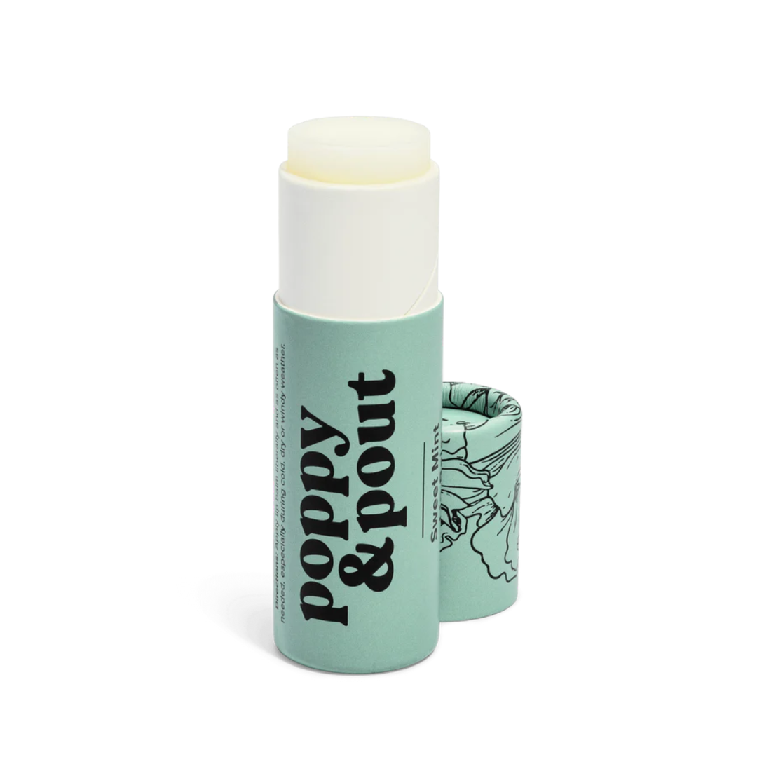 Mint green lip balm with floral design and 'Poppy & Pout' branding on a white background