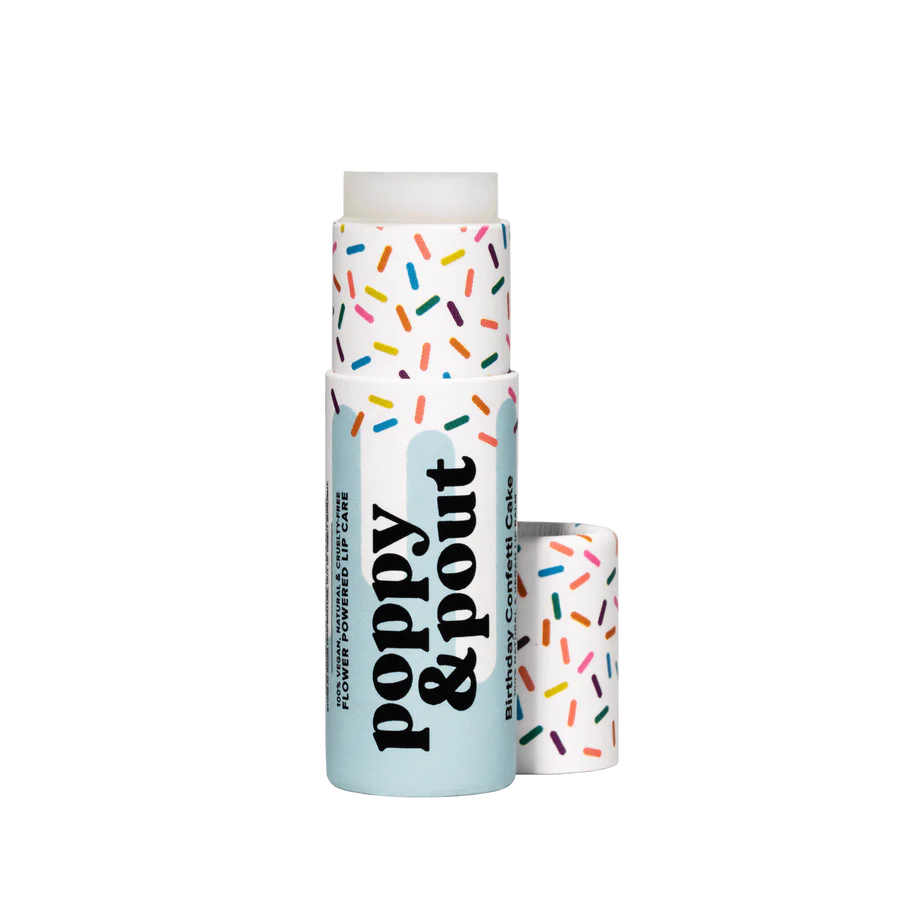 Lip balm with colorful sprinkles on a white background
