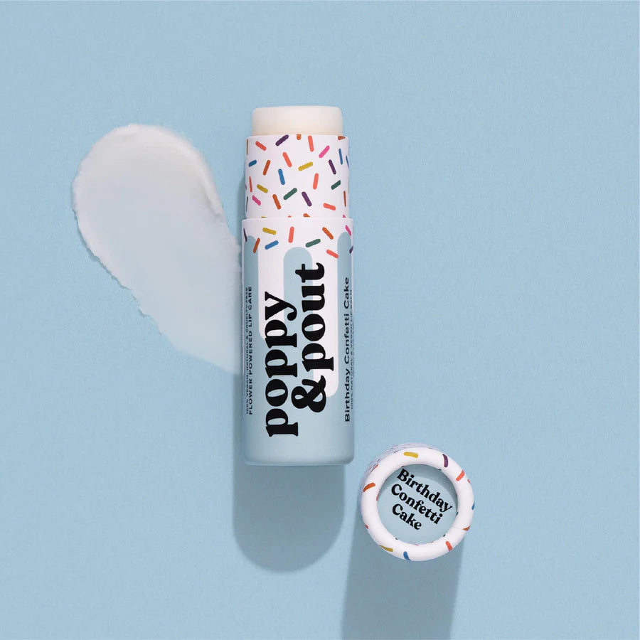Lip balm with colorful packaging on a light blue background