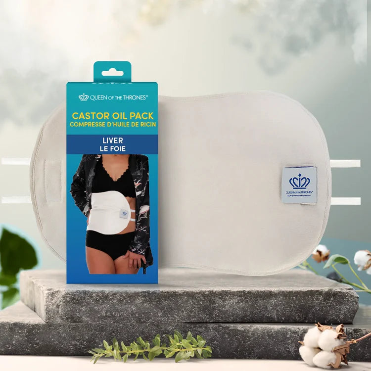 Castor oil pack with packaging on a decorative surface