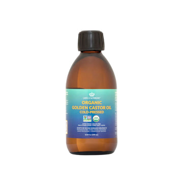 Bottle of organic golden castor oil with a blue label on a white background
