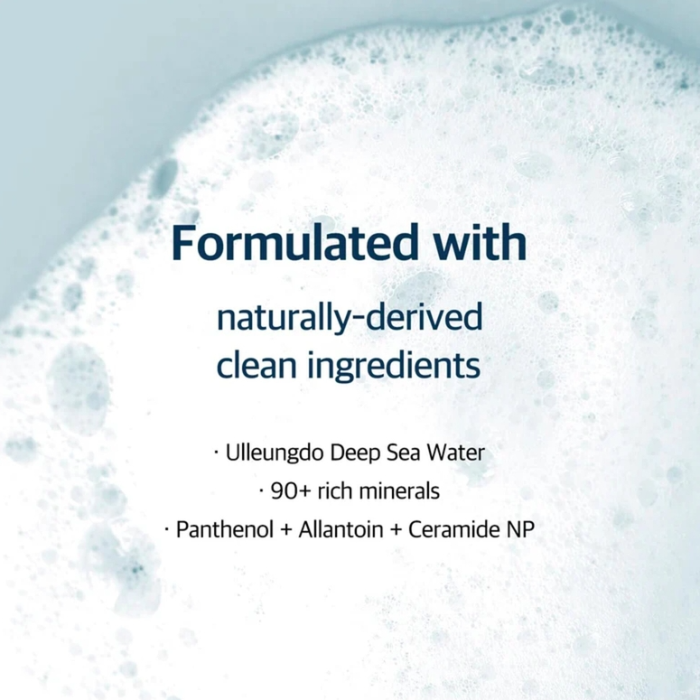 Text on a background of white bubbles with 'Formulated with naturally-derived clean ingredients' text.