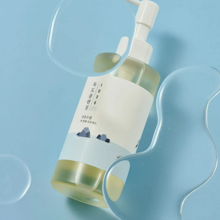 Skincare bottle with pump on a light blue background