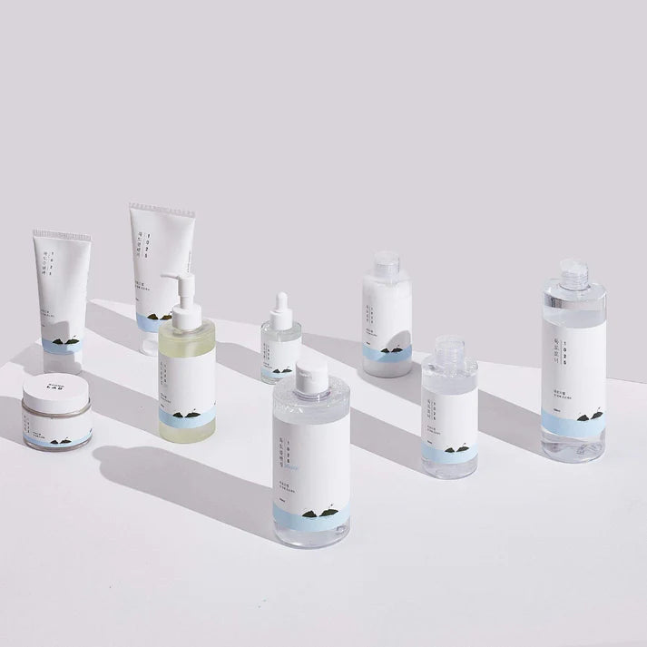 Collection of skincare products on a light gray background