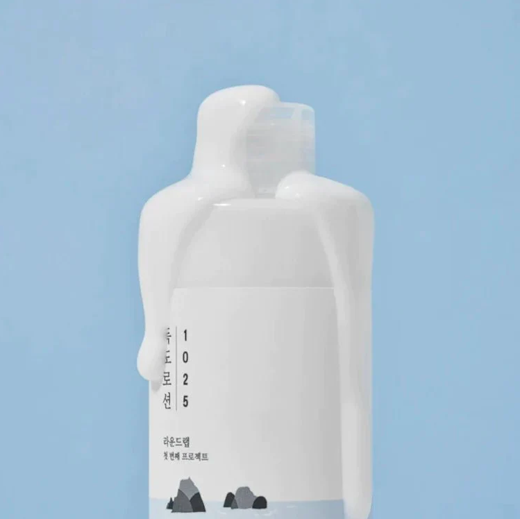 White bottle with text on a light blue background