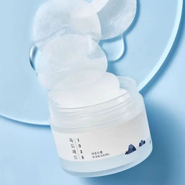 White breast pump on a light blue background