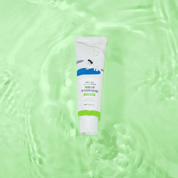 Tube of cream on a green textured background