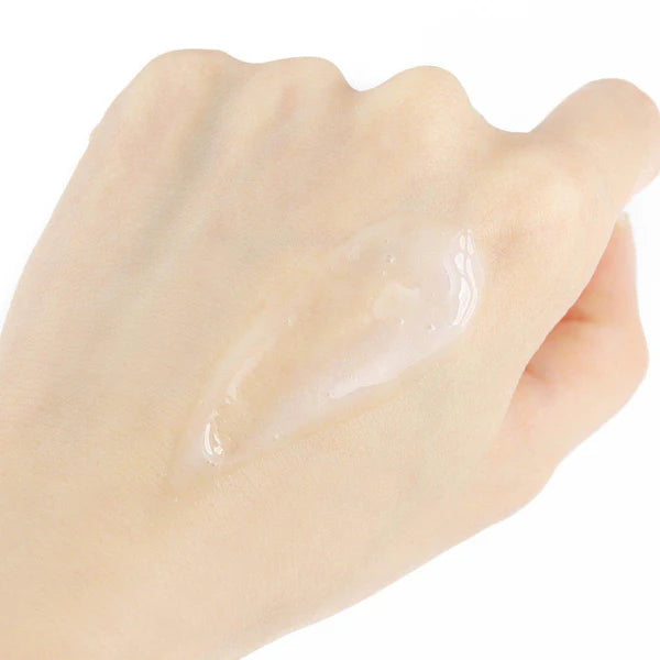 Hand with a small amount of clear gel on the palm against a white background