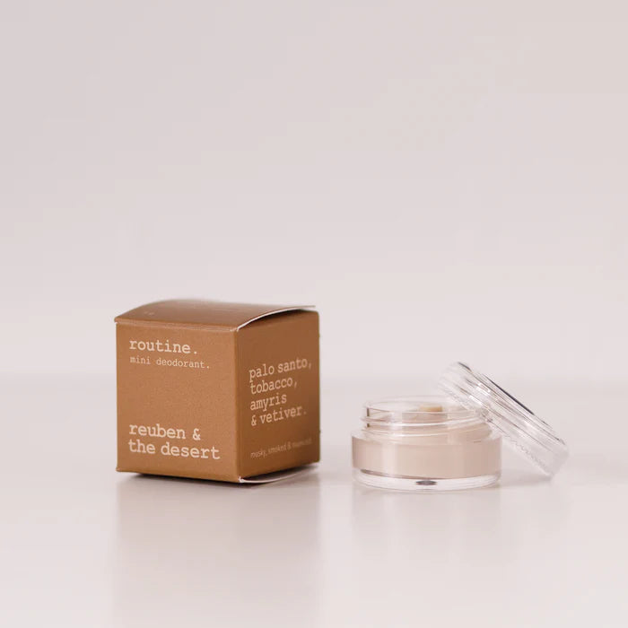 Jar of cream and its packaging on a white background