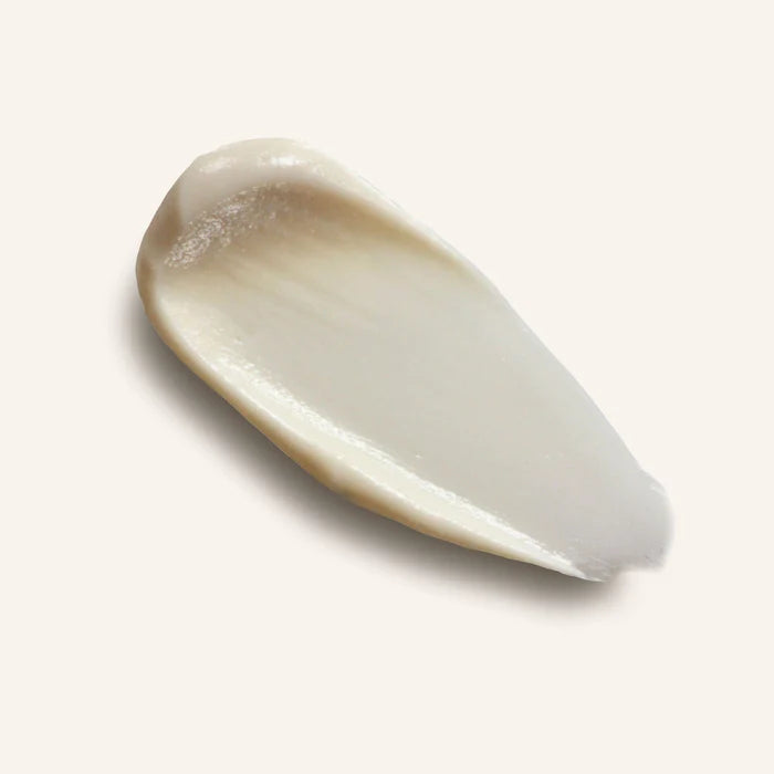 Close-up of a beige cosmetic product smear on a light background