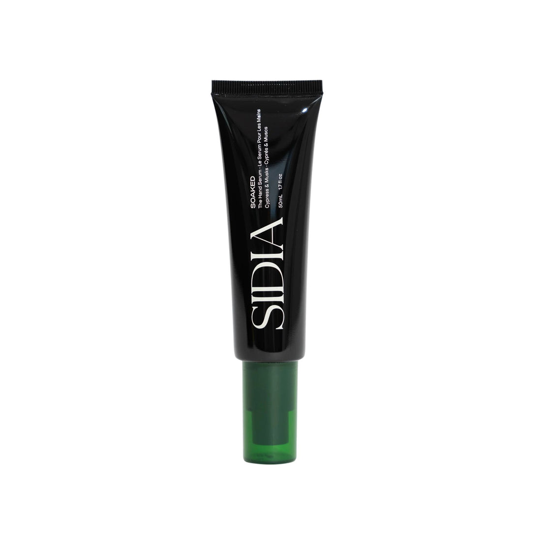 Black cosmetic tube with green cap on a white background