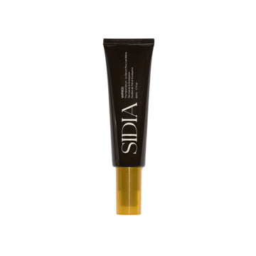 Black cosmetic tube with gold base on a white background