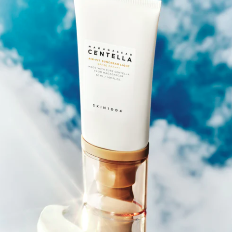 Skintouch Centella product with a blue and white cloud background