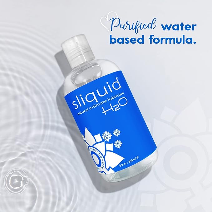 Sliquid H2O lubricant bottle on a water background with text about purified water formula.