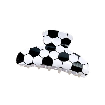 Black and white checkered hair clip on a white background
