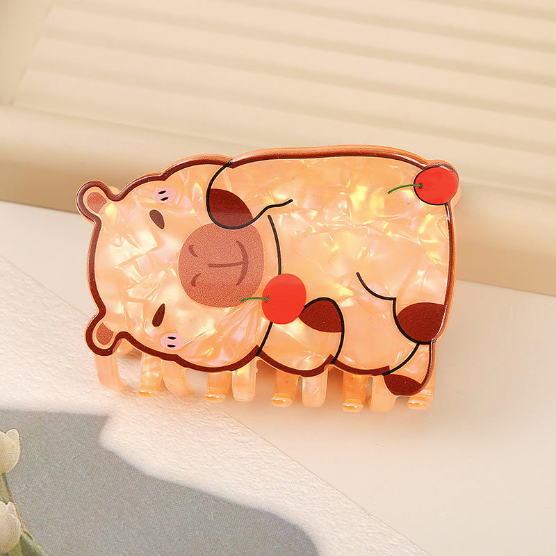 Cute cartoon piggy bank with string lights on a soft surface