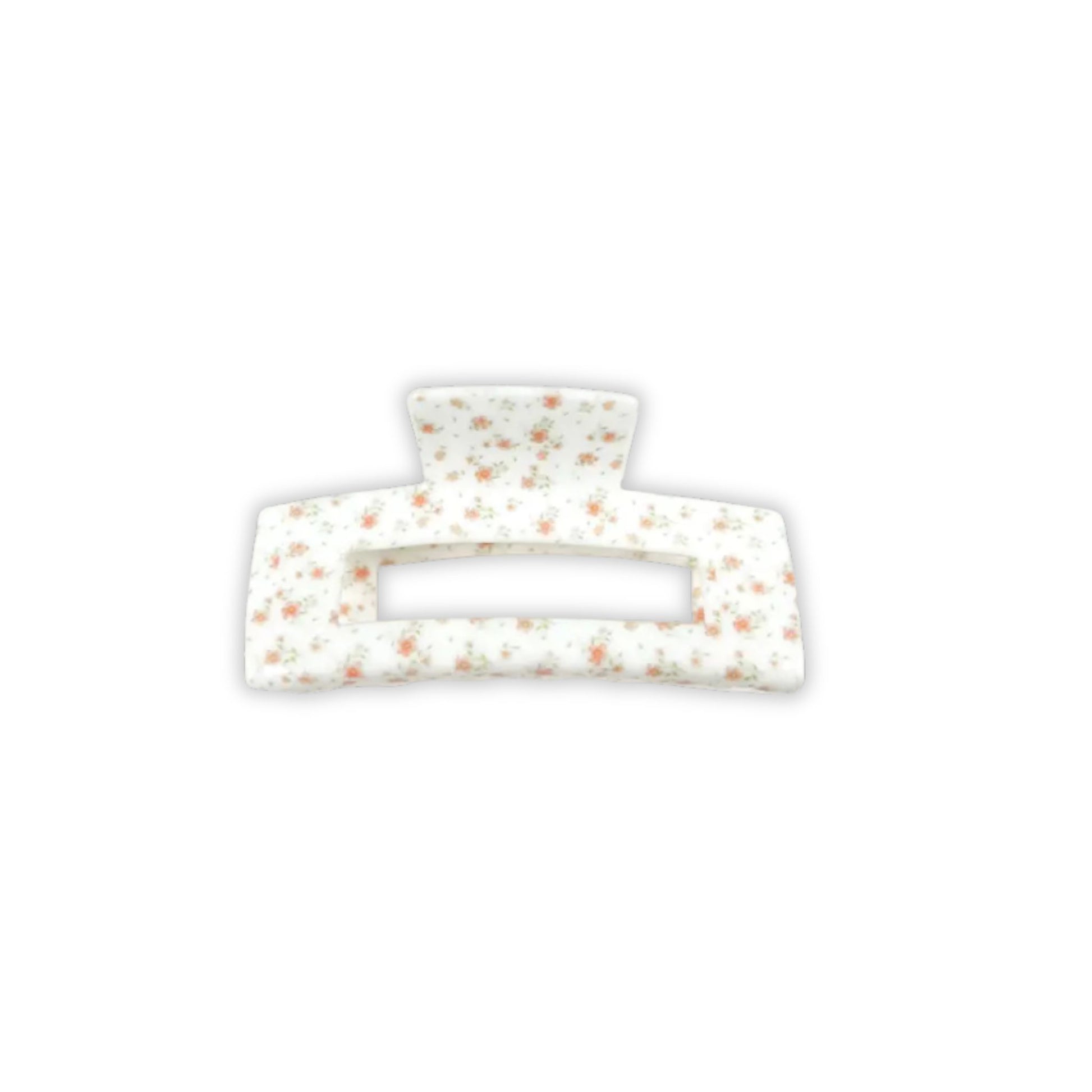 Rectangular hair clip with a white base and brown speckles on a white background