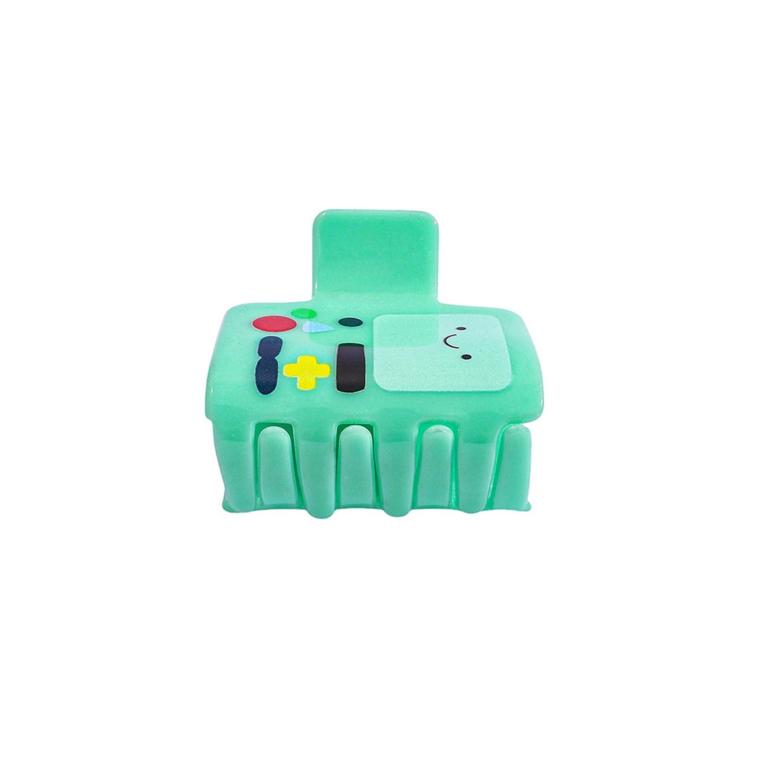 Green toy resembling a game controller with cartoon face on a white background