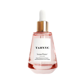 Bottle of TAHNYC Serum Water on a white background