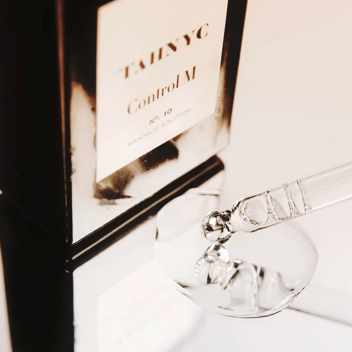 Close-up of The Pharmacy Lab TAHNYC Control M Mandelic Solution with serum dropper for gentle exfoliation and skin renewal