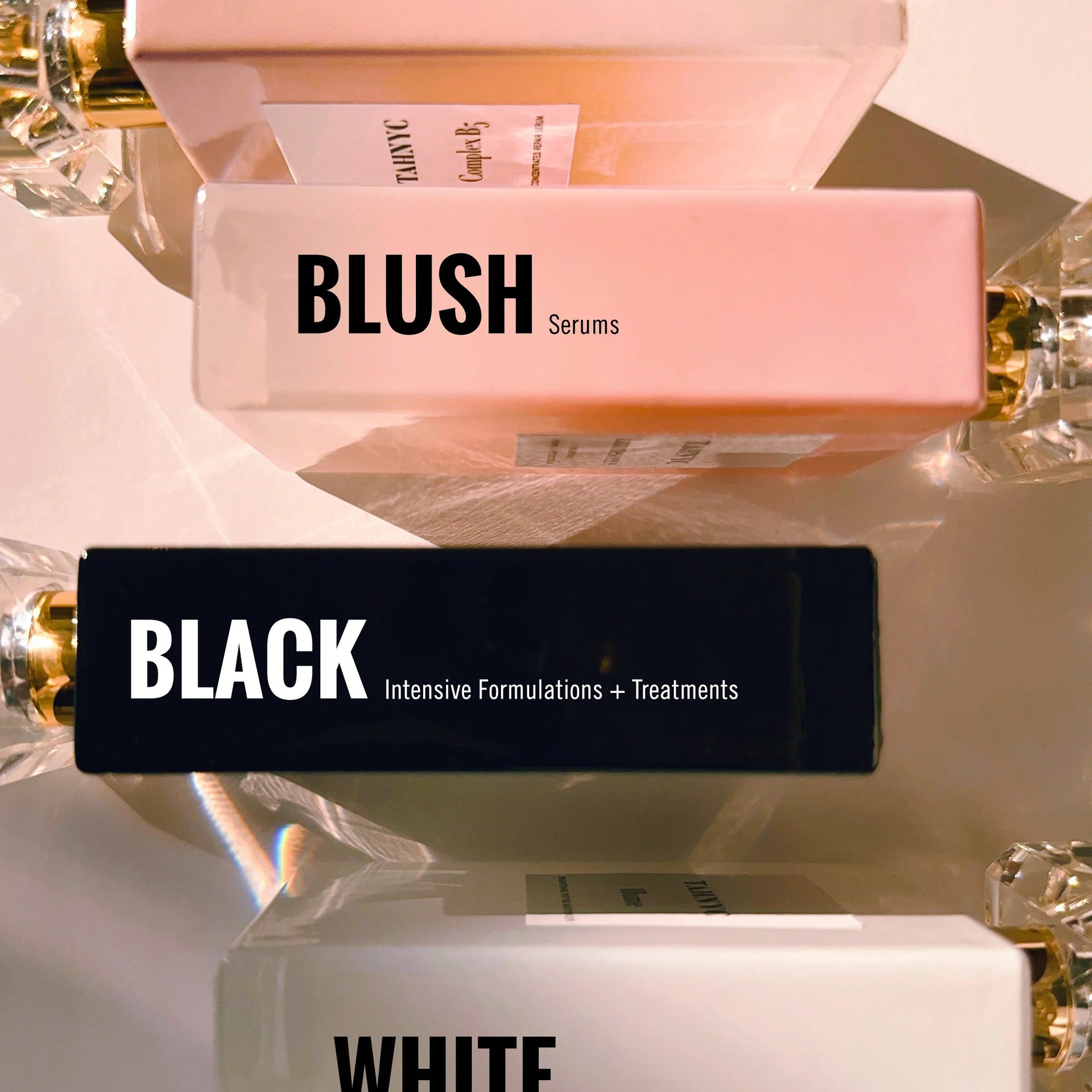 TAHNYC Skincare collection featuring Luminescence Serum in blush bottle with Black and White series moisturizers – The Pharmacy Lab